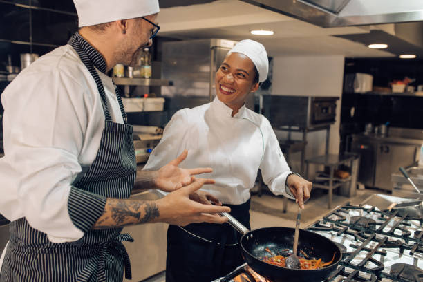 istock Chef is teaching his trainee how to be a good cook 1310767758