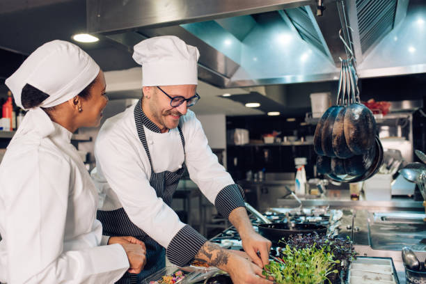 istock Chef and his trainee cooking at the restaurant kitchen 1310767771