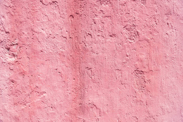 istock The surface of the walkway surface has weathered. High resolution through pink retouching process. A beautiful old pink concrete wall. Cement texture or pink concrete wall for the background. 1310768838