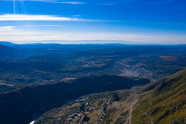 istock Mountains and green forest view from drone 1310770889