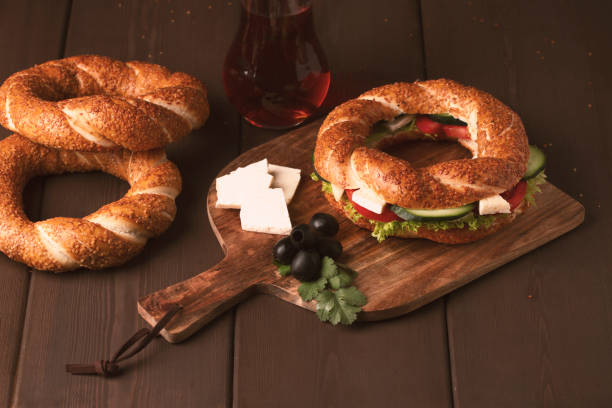 istock Traditional Turkish bagel simit, breakfast, on a wooden table, rustic, horizontal, no people 1310774107