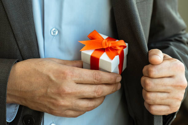 Businessman giving Gift Box