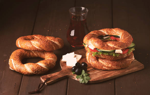 istock Traditional Turkish bagel simit, breakfast, on a wooden table, rustic, horizontal, no people 1310774589