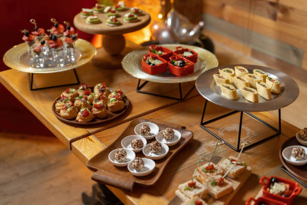 istock Catering table, beautiful wooden table, warm light. 1310775384
