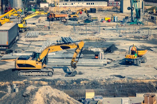 istock Construction site with heavy machines in the urban populated area. 1310776835