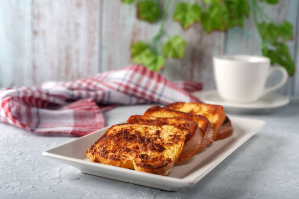 French toast with tea on a gray background. Healthy breakfast concept.