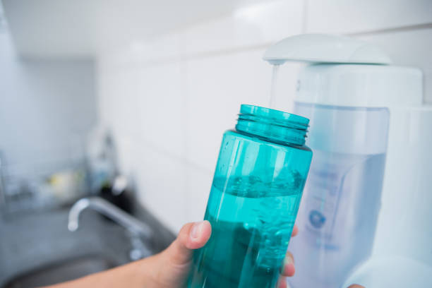 istock putting water in the plastic bottle 1310779242