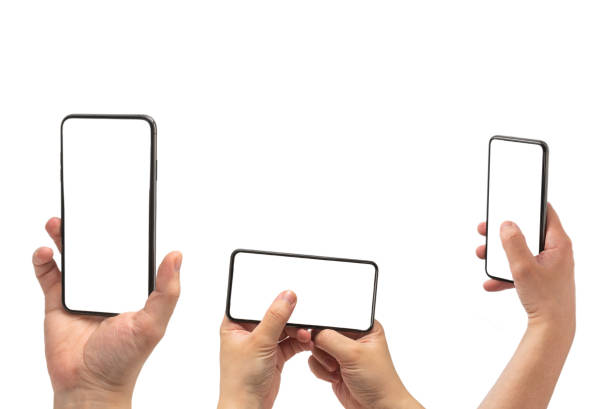 istock Smart phone in man hand isolated on white background.  White screen. 1310780766