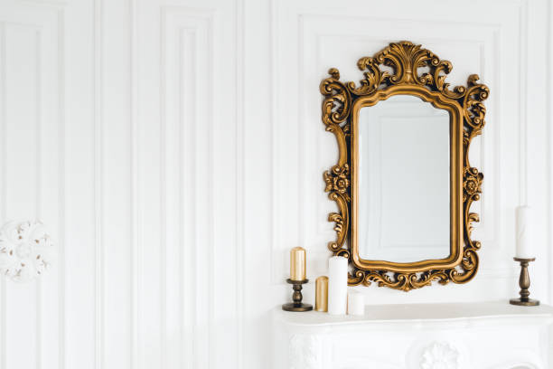 istock Old vintage mirror with gold colored wooden ornament frame, copy space. 1310781088