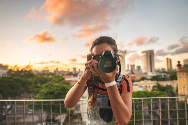 istock Photographer taking photo at sunset 1310782002