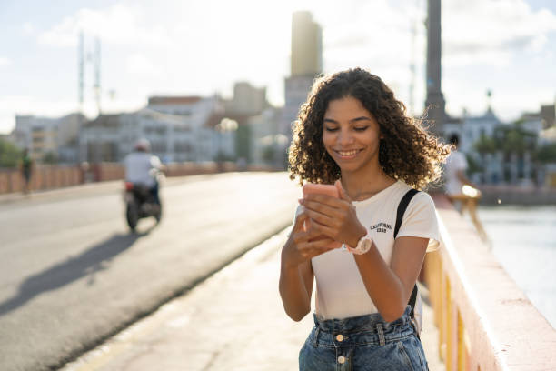 istock Teen girl using smart phone in Recife Pernambuco 1310782126