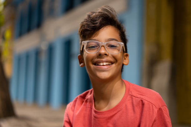istock Boy smiling and looking at the camera at night 1310782150
