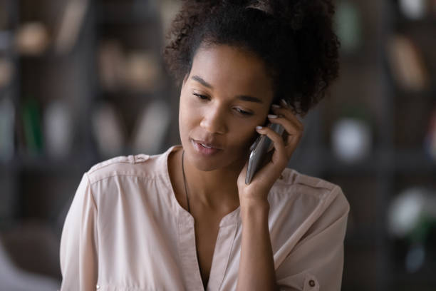 istock African American woman talk on smartphone gadget 1310784961