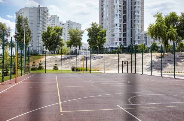 istock Basketball court from behind fence 1310786878