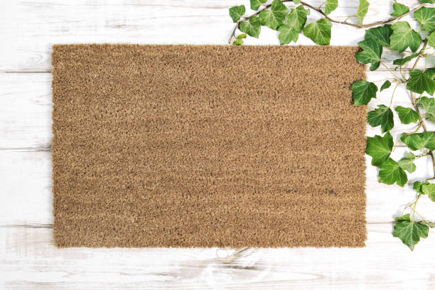 istock Coir doormat Floral template mockup wooden background 1310786887