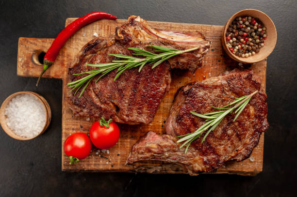istock Beef steak, herbs and spices on a stone background 1310786976