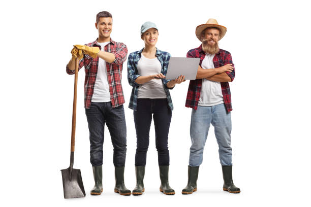istock Group of farmers with a laptop computer 1310788195