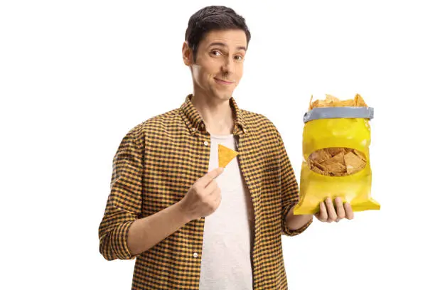 Photo of Guy holding a pack of tortilla chips
