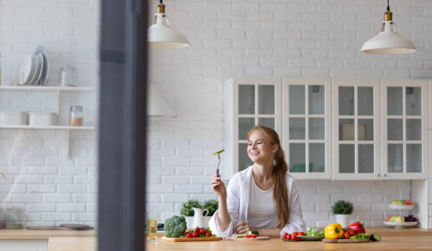 istock Young woman cooking in the kitchen. 1310789782
