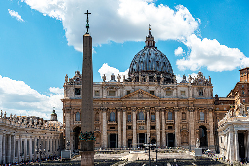 Vatican City, Vatican City State - Jun 01, 2014: St. Peter's Basilica at Via della Conciliazione in Rome, Italy. The Basilica of St. Peter, in the Vatican, is the center of the Catholic religion, one of the most visited places in the world and in Rome for its immense artistic and architectural treasures. Vatican City State.