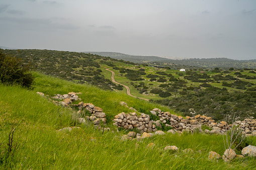 A view of the Adullam region of Israel from the archeological site of Khirbat Umm Burj, on a hazy day.