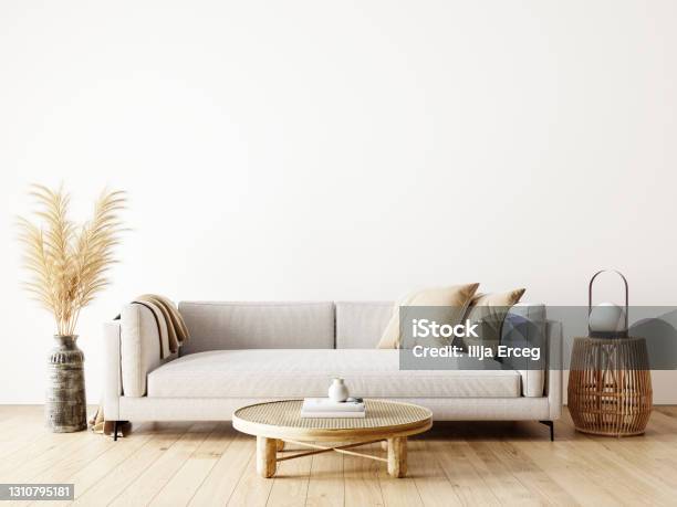 Modern Interior Design Of Living Room In Natural Colors With Dry Plants Decoration And Empty White Mock Up Wall Background Stock Photo - Download Image Now