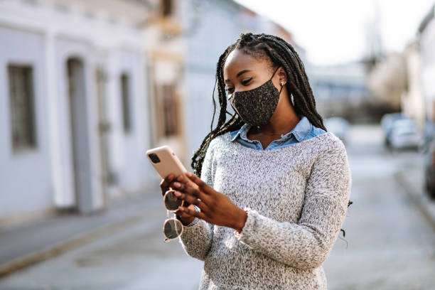 istock African American woman using phone in downtown 1310795767