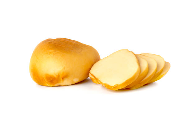 istock Cheese on a white background. Smoked cheese close-up on a white background. 1310797443