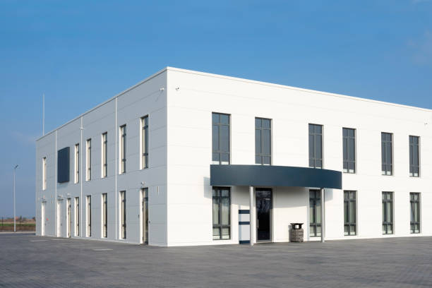 istock White office building against the blue sky. Service center 1310804297