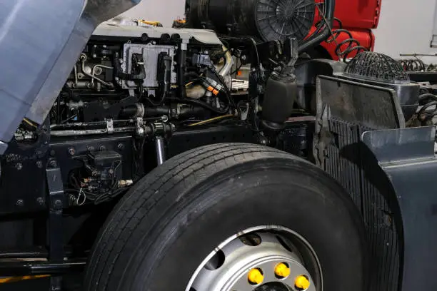 Photo of Truck repair in a car service, car cabin close up. Technical inspection of the car at the service center