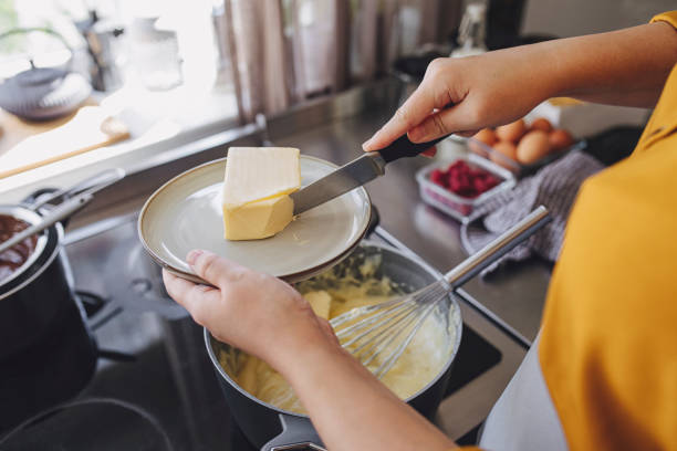 Anonymous Young Woman Preparing Cream for a Cake