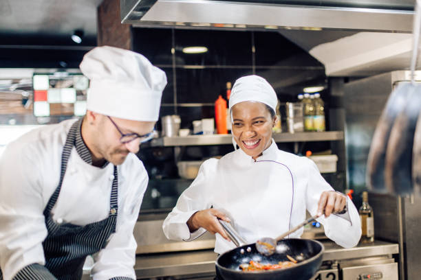 istock Happy cook learning to cook from the chef 1310808844