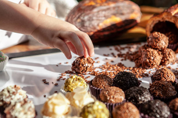 istock Decorated chocolate and party candy with hand 1310808966