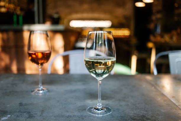 istock Two glasses of wine white and rose 1310809871