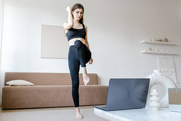 istock female does yoga exercises online 1310809878