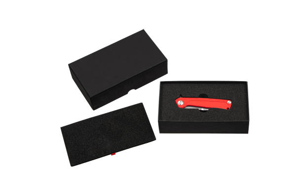 istock Red pocket folding knife isolate on white background. Compact metal sharp knife with a folding blade. 1310809911