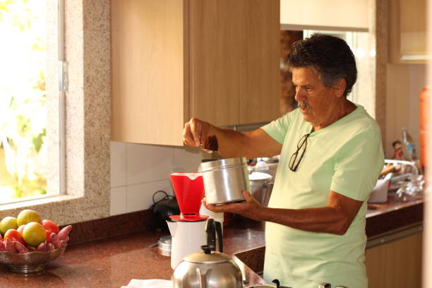 istock senior man making his coffee at home 1310810574