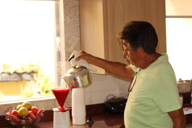 istock senior man making his coffee at home 1310810798