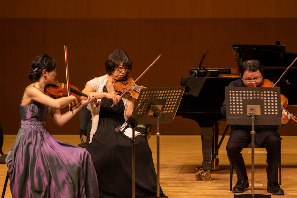 istock Musicians playing violin and viola at classical music concert 1310813906