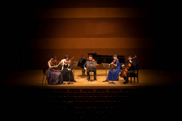 istock Five musicians playing violin, viola, and cello at classical music concert 1310813912