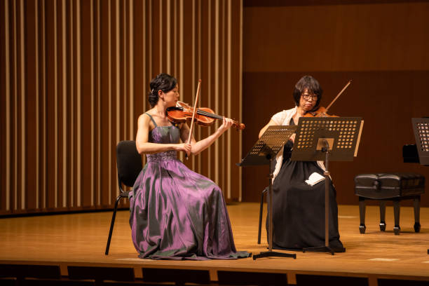 istock Musicians playing violin at classical music concert 1310813929