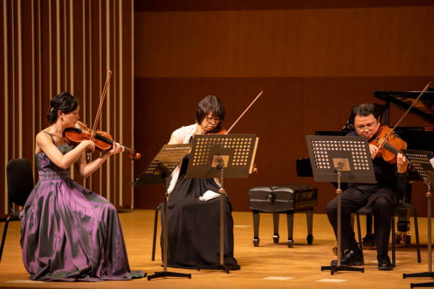 istock Musicians playing violin and viola at classical music concert 1310813931