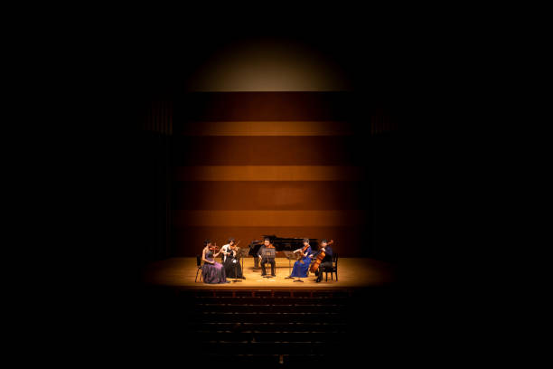istock Five musicians playing violin, viola, and cello at classical music concert 1310813933