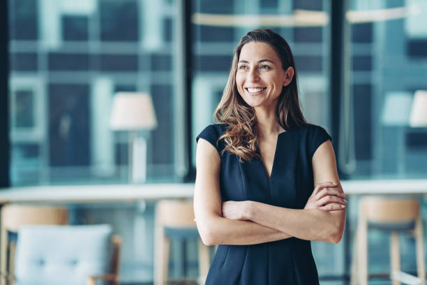 Portrait of a businesswoman standing in a a modern office Portrait of a businesswoman standing in the office portrait stock pictures, royalty-free photos & images