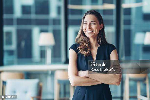 Portrait Of A Businesswoman Standing In A A Modern Office Stock Photo - Download Image Now