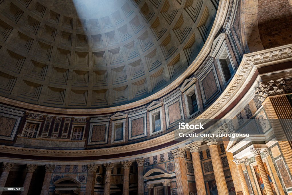 Pantheon dome view from inside in Rome, Italy View of interior of the Pantheon, also known as temple of all the gods. It is a former Roman temple, now a church in Rome, Italy. (Temple of all the gods) Church Stock Photo