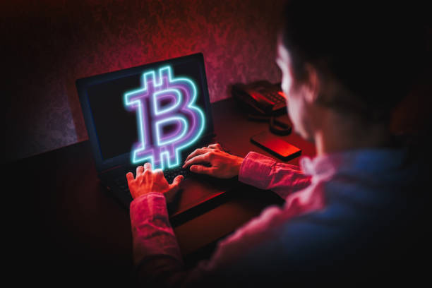 istock Unrecognizable person using his laptop to trade Bitcoin. Bitcoin / Cryptocurrency concept. 1310818696