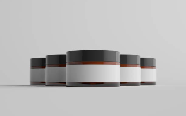 istock Amber Glass Cosmetic Jar Mockup - Multiple Jars. Blank Label 1310818961