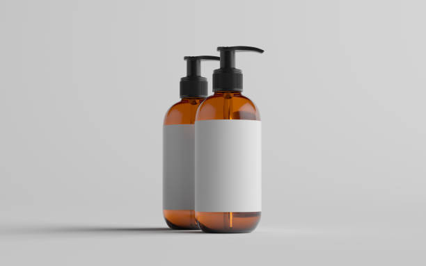 istock Amber Glass Pump Bottle Mock-Up - Liquid Soap, Shampoo Dispenser - Two Bottles. Blank Label 1310818967