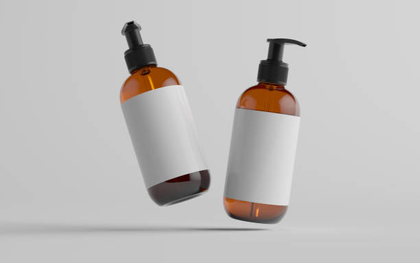 istock Amber Glass Pump Bottle Mock-Up - Liquid Soap, Shampoo Dispenser - Two Bottles. Blank Label 1310818970